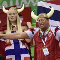 Norwegian fans sporting Viking helmets cheer on their team during the women\'s quarterfinal handball match against Sweden on Tuesday at the Rio de Janeiro 2016 Olympics Games. | AFP-JIJI
