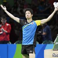 Jun Mizutani celebrates beating China\'s Xu Xin in the singles match during their men\'s table tennis gold medal match at the Rio de Janeiro 2016 Olympic Games on Wednesday. | KYODO