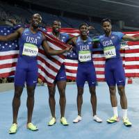 Arman Hall, Tony McQuay, Gil Roberts and LaShawn Merritt of the United States celebrate winning the gold medal in the men\'s 4x400-meter relay final on Saturday at the 2016 Summer Olympics in Rio de Janeiro. | AP