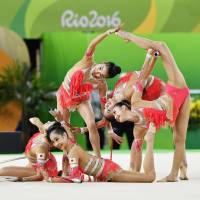 Japan performs during the rhythmic gymnastics group all-around qualifications at the 2016 Summer Olympics in Rio de Janeiro on Saturday. | KYODO