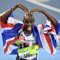 Mo Farah of Britain celebrates clinching the gold medal in the men\'s 5,000-meter final on Saturday at the 2016 Rio Games. | AP