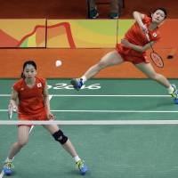 Japan\'s Misaki Matsutomo (left) and Ayaka Takahashi compete during the Olympic women\'s badminton competition on Thursday in Rio de Janeiro. | AP