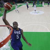 Kevin Durant goes up for a dunk during the U.S. team’s victory over Serbia in the final of the men’s basketball tournament at the 2016 Summer Games in Rio de Janeiro. U.S. routs Serbia for third straight gold in men's basketball