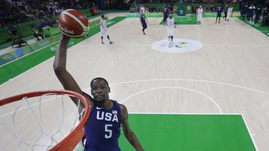 Kevin Durant goes up for a dunk during the U.S. team’s victory over Serbia in the final of the men’s basketball tournament at the 2016 Summer Games in Rio de Janeiro. U.S. routs Serbia for third straight gold in men's basketball