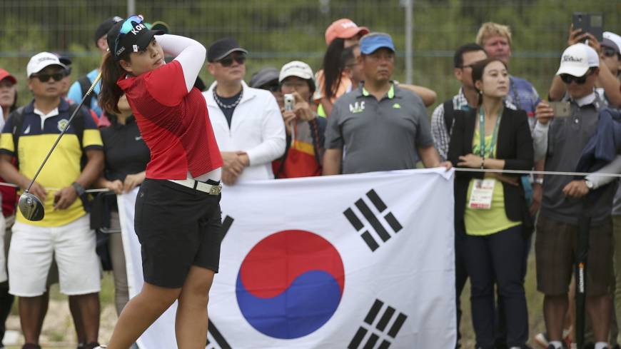 Inbee Park watches her tee shot on the 15th hole during the final round of the Olympic tournament on Saturday. Park grabs gold as Nomura just misses medal