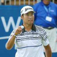 Hideki Matsuyama acknowledges the gallery after making par on the 18th hole in the final round of the Wyndham Championship in Greensboro, North Carolina, on Sunday. Matsuyama finished in a tie for third place. | KYODO