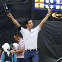 Ryo Ishikawa celebrates after winning the Rizap KBC Augusta in Itoshima, Fukuoka Pref., on Sunday. | KYODO