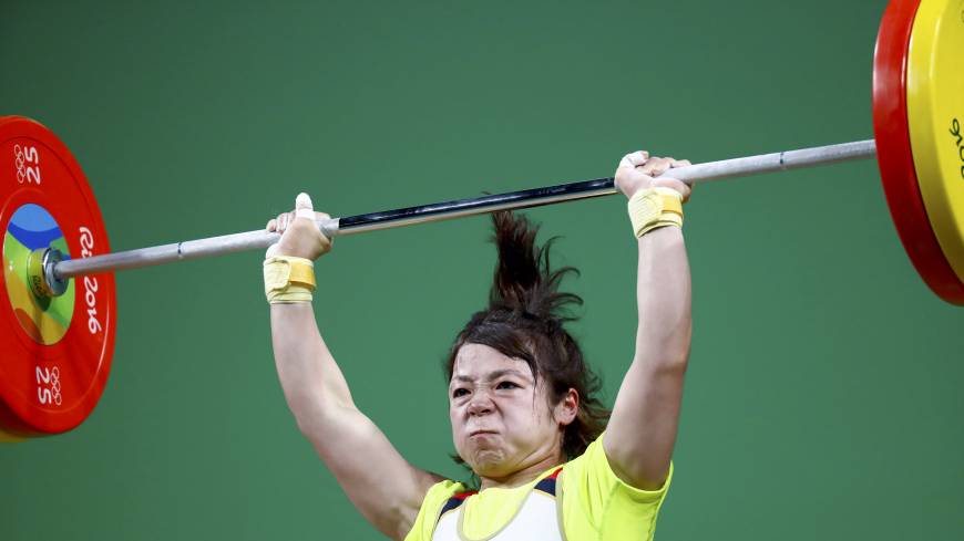 Hiromi Miyake competes in the women’s weightlifting competition on Saturday in Rio de Janeiro. Powerful Miyake takes bronze in weightlifting