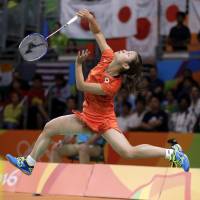 Nozomi Okuhara competes during the semifinals of the women\'s badminton singles competition at the Rio Games on Thursday. Okuhara was awarded the bronze medal Friday after her opponent withdrew from the third-place match with an injury. | AP