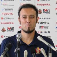 Nagoya Grampus defender Marcus Tulio Tanaka attends a news conference on Sunday after rejoining the J. League club. | KYODO