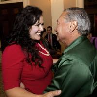 Assemblywoman Lorena Gonzalez, D-San Diego, receives congratulations from Arturo Rodriguez, president of the United Farm Workers, after the assembly approved her bill requiring farmworkers to receive overtime pay after working eight hours, at the Capitol in Sacramento Monday. | AP