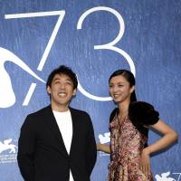 Director Kei Ishikawa (left) and actress Hikari Mitsushima pose during a photo call for \"Gukoroku\" (\"Traces of Sin\") at the 73rd Venice Film Festival in Venice, Italy, Tuesday. | ANSA / VIA AP