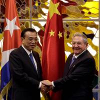 Chinese Premier Li Keqiang and Cuban President Raul Castro meet at Havana\'s Revolution Palace on Saturday. | REUTERS