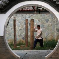 Kung fu master Xing Xi practices at his Kung Fu Zen academy in Beijing at the end of June. | REUTERS