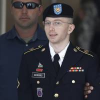 U.S. Army Private First Class Bradley Manning departs the courthouse at Fort Meade, Maryland, in 2013. Manning is a transgender who now goes by the name Chelsea. | REUTERS