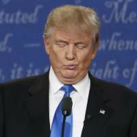 Republican U.S. presidential nominee Donald Trump reacts during the first presidential debate with Democratic nominee Hillary Clinton at Hofstra University in Hempstead, New York, on Monday. | REUTERS