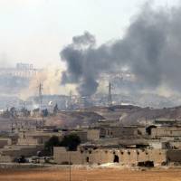 Smoke billows Sunday from a location on the southern outskirts of the Syrian city of Aleppo after regime forces retook control of three militaries academies from rebel fighters. | AFP-JIJI