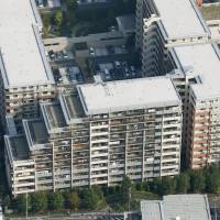 Residents of these four residential buildings in Yokohama agreed Monday to have the entire complex rebuilt. | KYODO