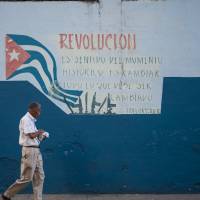 A Havana mural quotes Fidel Castro: \"Revolution is a sense of the historical moment; it changes everything that must be changed.\" | ISTOCK