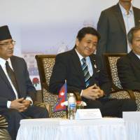 Senior Vice Foreign Minister Nobuo Kishi (center) attends a ceremony in the Nepalese capital of Kathmandu on Thursday to mark the 60th anniversary of the establishment of diplomatic ties between the two countries. | KYODO
