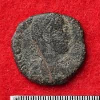 A coin issued by the Roman Empire and recently excavated from castle ruins in Okinawa is shown Monday at the Uruma Municipal Government office in Okinawa. | KYODO