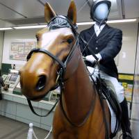A life-size figure showing riding gear for the equestrian event is displayed at Nerima Station The Paralympics will run through Sept. 21.. | SATOKO KAWASAKI