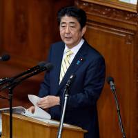 Prime Minister Shinzo Abe answers questions from an opposition party member Tuesday in the Lower House. | AFP-JIJI