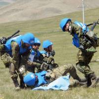 Self-Defense Forces troops take part in the multinational peacekeeping exercise Khaan Quest in Tavan Tolgoi, Mongolia, on May 27. | KYODO