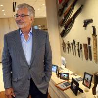 Businessman Dick Portillo is seen with military memorabilia in his Oak Brook Terrace, Illinois, office on Sept. 8. Portillo is on a quest to determine whether a gold tooth discovered is that of Adm. Isoroku Yamamoto, a mythic figure in Japanese history who planned the Pearl Harbor attack. Chicago hot dog czar may have Japanese World War II admirals's gold tooth