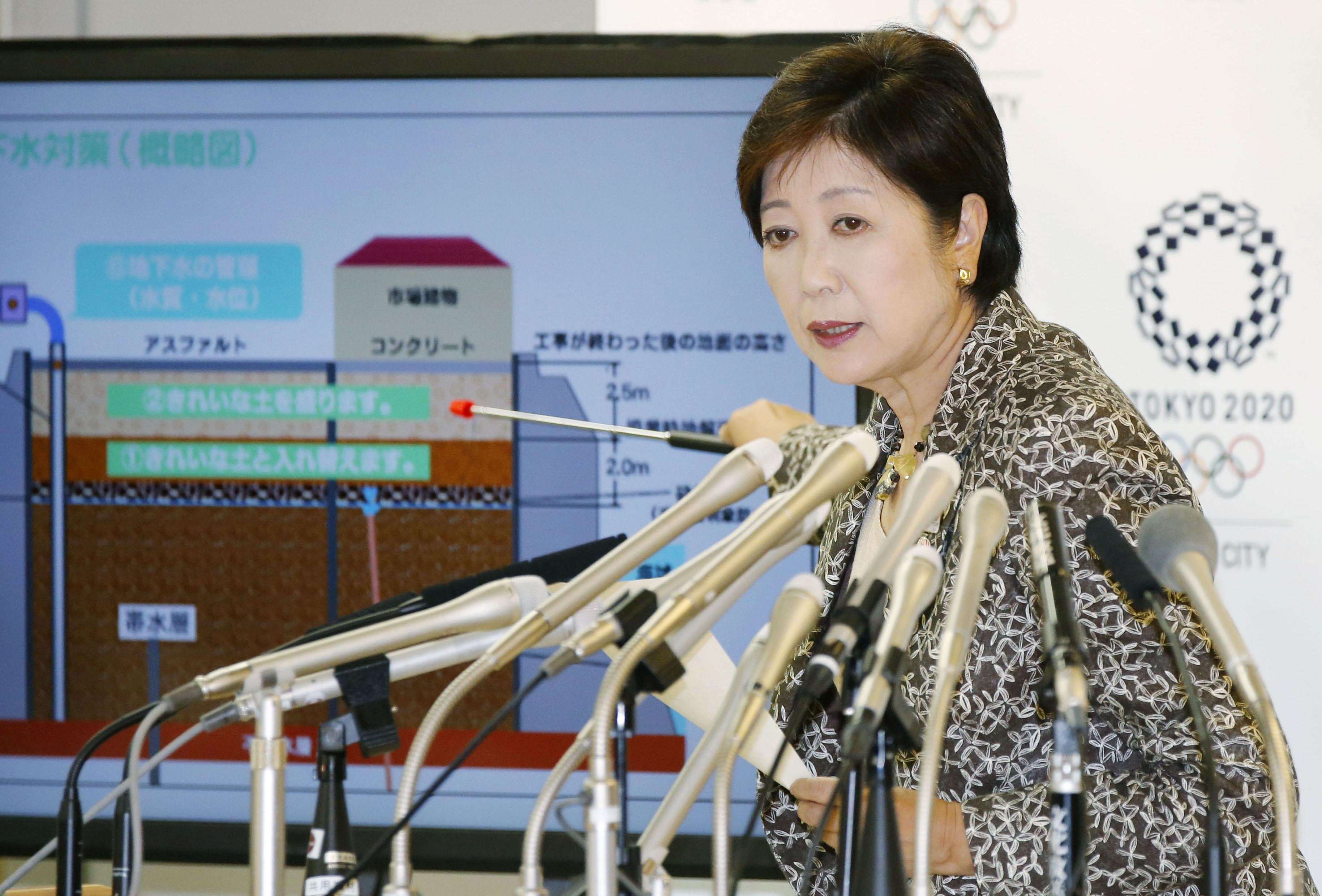 Tokyo Gov. Yuriko Koike tells reporters at a news conference Saturday in Tokyo that clean soil was not placed under three main structures of the planned Toyosu food wholesale market in Koto Ward, where the famed Tsukiji fish market is to be relocated. | KYODO