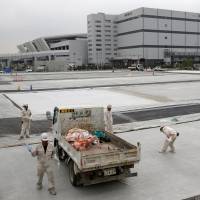 Workers are seen at the new Tokyo Metropolitan Central Wholesale Market on Sept. 27, known as Toyosu market, which will take over from the famous Tsukiji market. | REUTERS