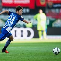 Genki Haraguchi runs with the ball during Hertha Berlin\'s 2-0 win over Ingolstadt in the German Bundesliga on Saturday. | AFP-JIJI