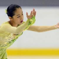Mako Yamashita performs to \"Nocturne\" during the women\'s short program at the Yokohama Junior Grand Prix on Friday. Yamashita is in second place with 64.86 points. | KYODO