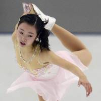 Marin Honda skates in the short program on Friday at the Yokohama Junior Grand Prix. Honda, the reigning world junior champion, is in fifth place with 55.47 points. | KYODO