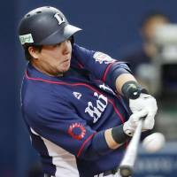 The Lions\' Hotaka Yamakawa hits a solo home run in the eighth inning against the Buffaloes on Tuesday at Kyocera Dome. Yamakawa finished with two homers and Seibu trounced Orix 11-1. | KYODO