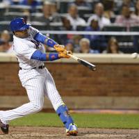 New York’s Yoenis Cespedes hits an RBI double against Philadelphia on Thursday. The Mets beat the Phillies 9-8 in 11 innings. Cabrera belts 11th-inning blast to lift Mets