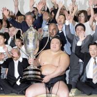 Ozeki Goeido celebrates after capturing his first title on Sunday. | KYODO