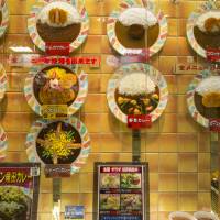 A shop window displays an array of plastic food displays, representing the curries on the menu.  | ISTOCK