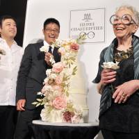 New York cake designer and pastry chef Sylvia Weinstock (right) poses with  Suzette Co. Ltd. President Goki Arita (center) and pastry chef Takahiro Komai at a press conference announcing the launch of a new brand, Henri &amp; Sylvia, under Suzette\'s Henri Charpentier line, at Ginza Maison Henri Charpentier on Sept. 7. | YOSHIAKI MIURA