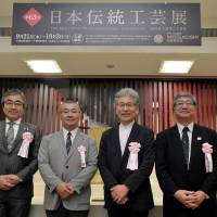 Managing Executive Officer and General Manager of Mitsukoshi\'s Nihombashi Store Yoji Naka; Kogei Association President\'s Prize winner Hiroaki Maruyama; Deputy Director of the Japan Kogei Association Kazumi Murose; and Councillor on Cultural Properties, Agency for Cultural Affairs Takamasa Saito pose at the opening ceremony of the 63rd Japan Traditional Kogei Exhibition, which runs through Oct. 3 at the Nihombashi Mitsukoshi Store, on Sept. 20. | YOSHIAKI MIURA