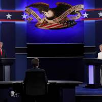 Republican U.S. presidential nominee Donald Trump and Democratic nominee Hillary Clinton begin their third and final 2016 presidential campaign debate at UNLV in Las Vegas, Nevada, on Wednesday. | REUTERS