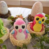 Hatched Umarete Woomo robotic birds are seen during a press preview in Tokyo on Thursday. | SATOKO KAWASAKI