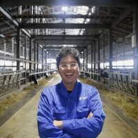 Jin Kawaguchiya, managing director of Kalm Kakuyama K.K., poses at the farm in Ebetsu, Hokkaido, on Sept. 6. | BLOOMBERG