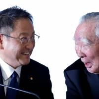 Toyota Motor Corp. President Akio Toyoda (left) and Suzuki Motor Corp. Chairman and CEO Osamu Suzuki attend a news conference in Tokyo on Wednesday. | REUTERS