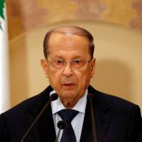 Michel Aoun talks during a news conference in Beirut on Oct. 20. | REUTERS
