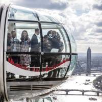 Britain\'s Princes William and Harry, and Kate, The Duchess of Cambridge, take a ride in a pod of the London Eye with members of the mental health charity Heads together on world mental health day in London Monday. | REUTERS