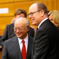 IAEA Director General Yukiya Amano (left) and Prince Albert II of Monaco arrive at a sideline event of the IAEA general conference in Vienna on Wednesday. | REUTERS