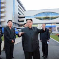 This undated picture released by North Korea\'s official Korean Central News Agency (KCNA) on Tuesday shows North Korean leader Kim Jong-Un inspecting the newly built Ryugyong General Ophthalmic Hospital in Pyongyang. | KCNA / AFP-JIJI