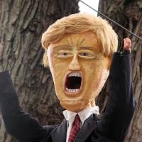 A Halloween display featuring a border wall and figures of Donald Trump, Hillary Clinton and Bernie Sanders is seen on the property of Matt Warshauer in West Hartford, Connecticut, Tuesday. | REUTERS