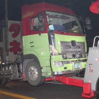 A trailer truck is seen being removed Saturday evening after it hit people taking part in a festival in Kanonji, Kagawa Prefecture. | KYODO